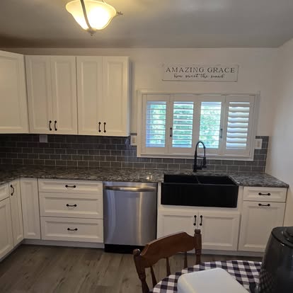 Completed Clarks kitchen remodeling project with white cabinetry